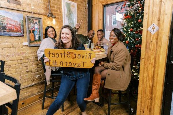 friends enjoying a meal at the River Street Tavern