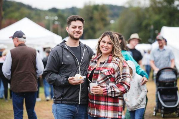 a couple enjoying food at the Apple Festival