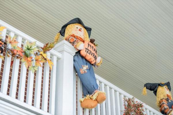 a scarecrow on a balcony